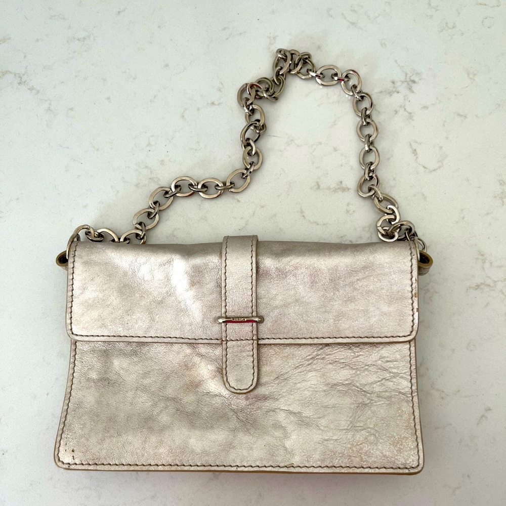 FURLA leather clutch with shoulder strap in metallic color.